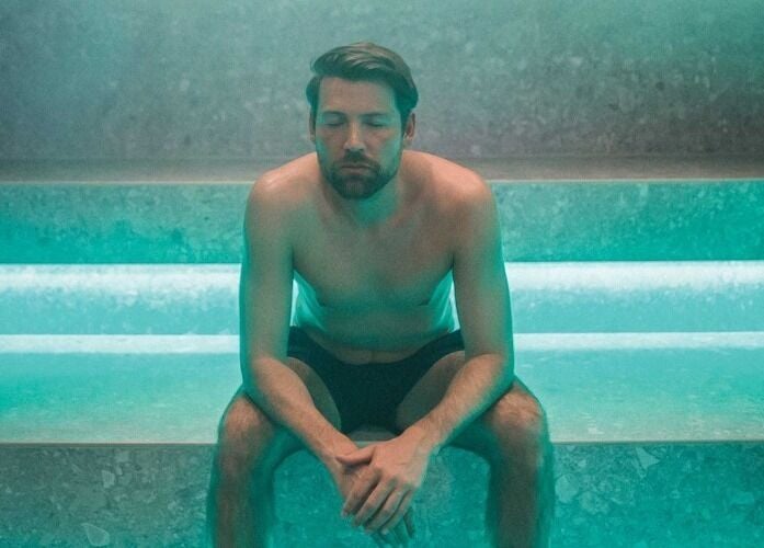 Man relaxing in steam room at St. M’s Thera Spa, Twickenham, England, GB, enjoying serene ambiance.