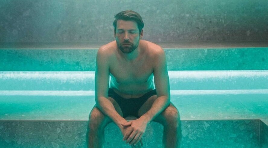 Man relaxing in steam room at St. M’s Thera Spa, Twickenham, England, GB, enjoying serene ambiance.