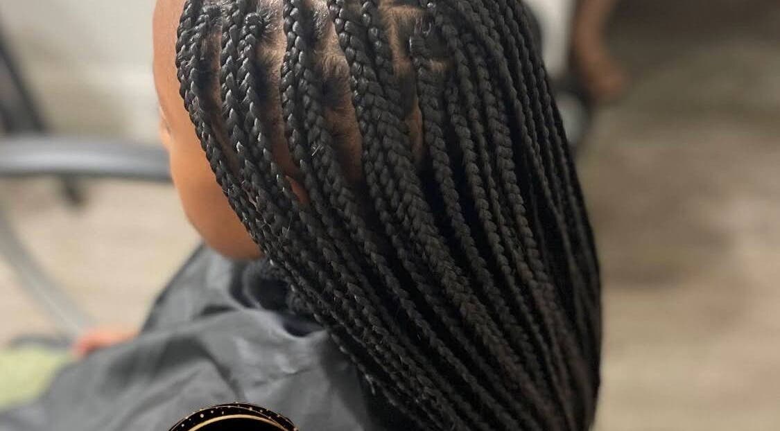 Intricate braided hairstyle at MAELYA BEAUTY, Sacramento, California, US showcasing expert styling techniques.