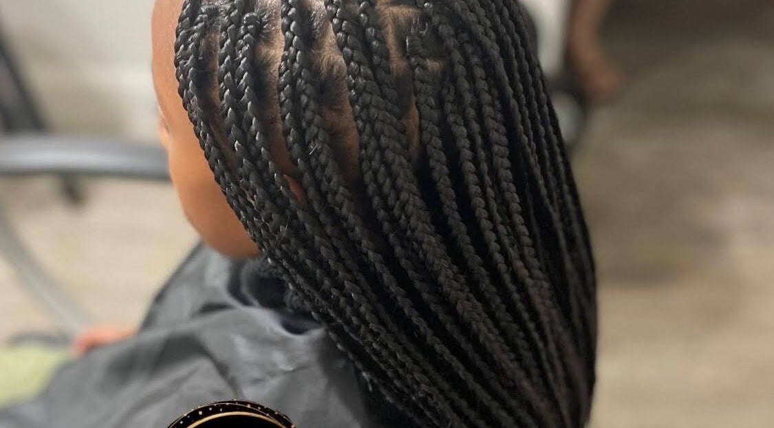 Intricate braided hairstyle at MAELYA BEAUTY, Sacramento, California, US showcasing expert styling techniques.