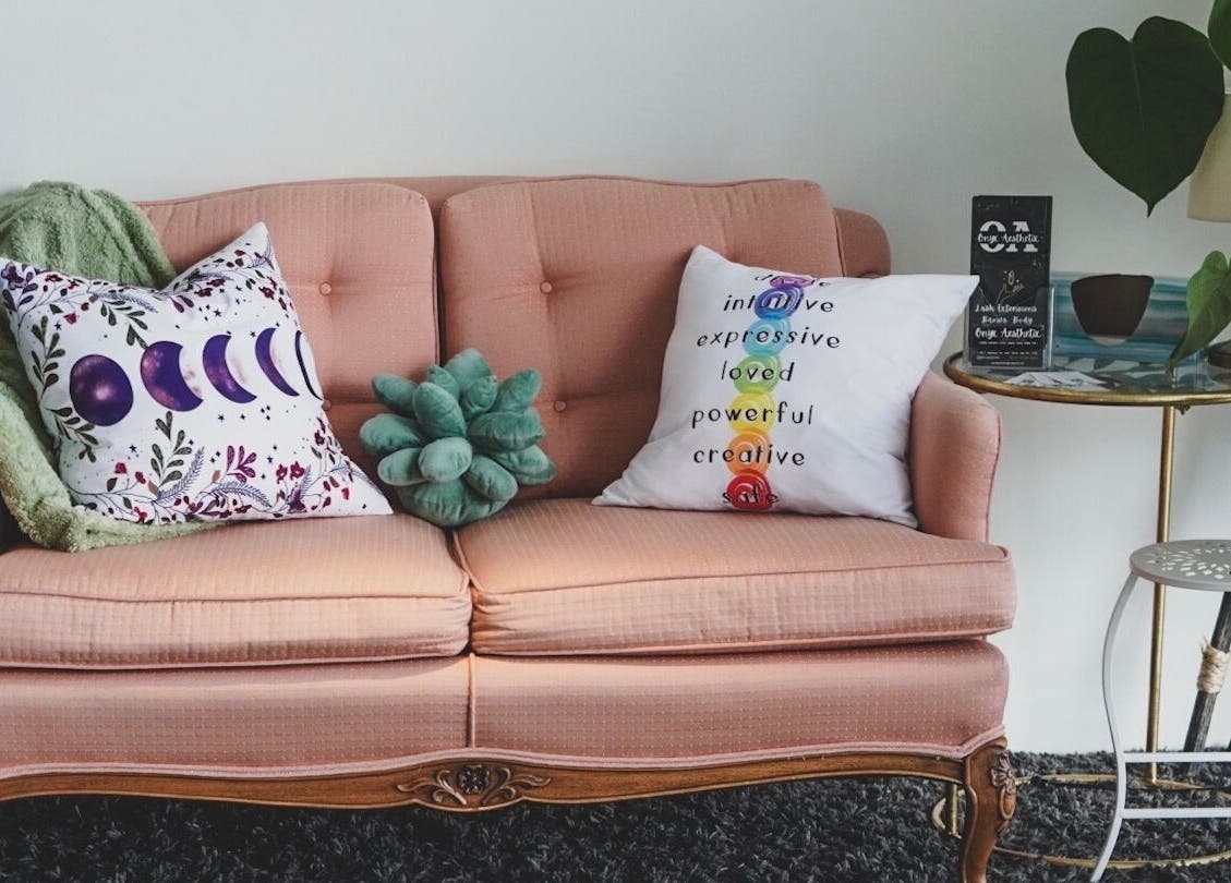 Charming seating area at Nailed by Krisana, Liberty Lake, Washington, US with plush sofa and decor.