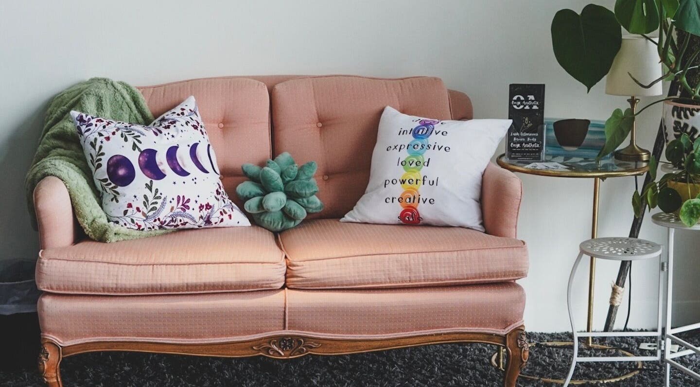 Charming seating area at Nailed by Krisana, Liberty Lake, Washington, US with plush sofa and decor.
