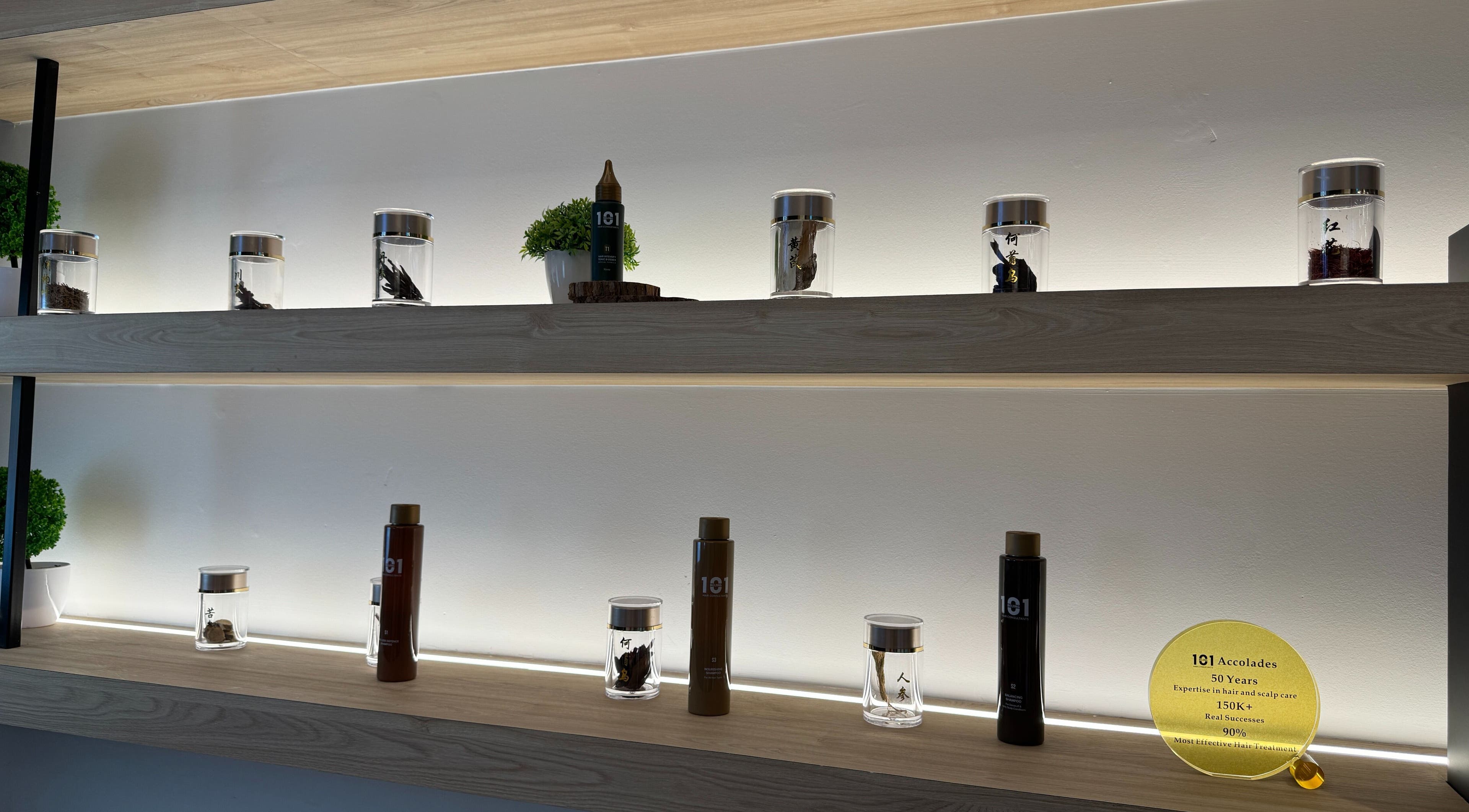 Elegant shelves at Beijing 101 @ NEX in Singapore displaying jars and products in a calming ambiance.