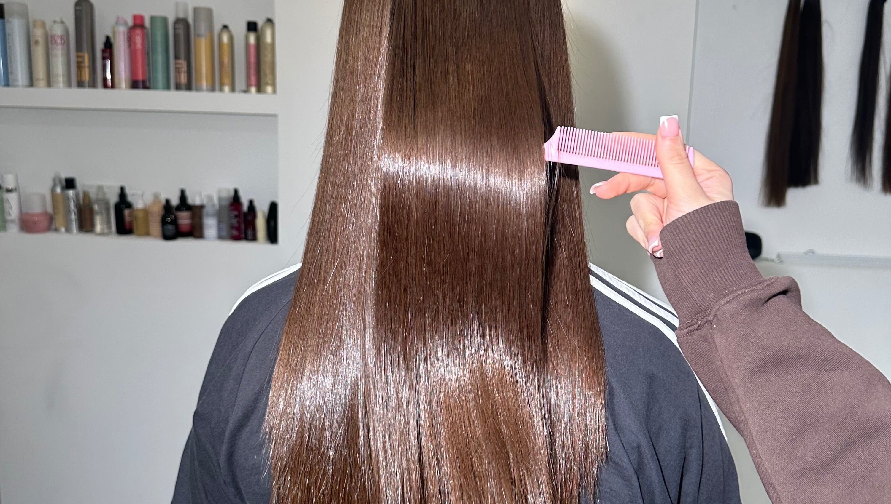 Sleek hair treatment at Nanoplastyhaus, Melbourne, Victoria, AU showcasing shiny, straightened locks.