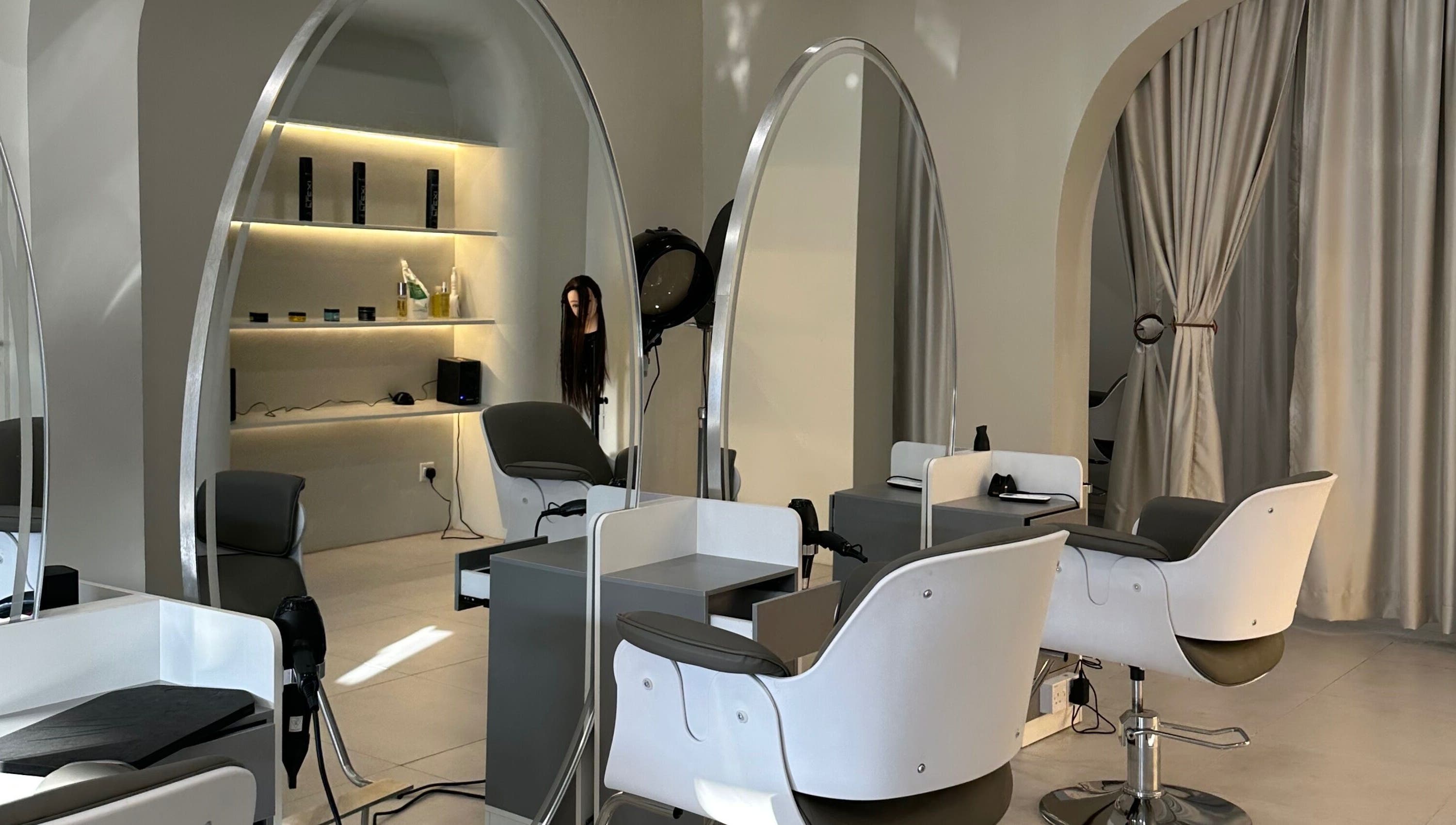 LILS SALON in Cyberjaya, Selangor, MY features stylish chairs and mirrors with elegant arches.