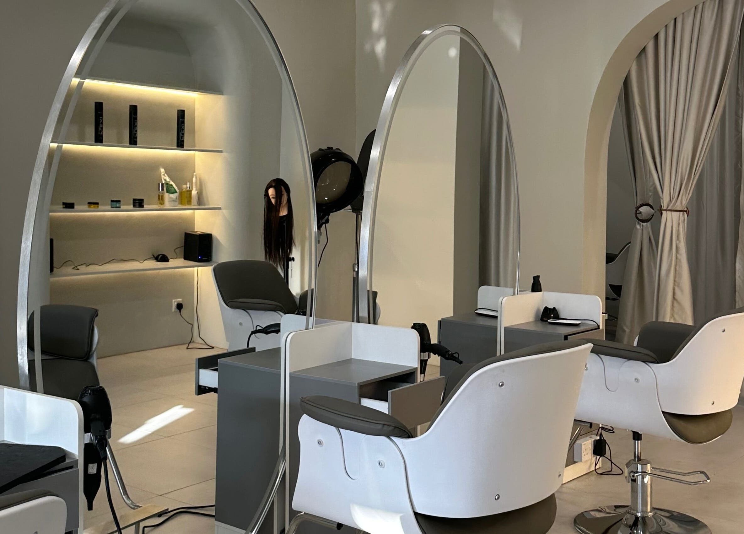 LILS SALON in Cyberjaya, Selangor, MY features stylish chairs and mirrors with elegant arches.