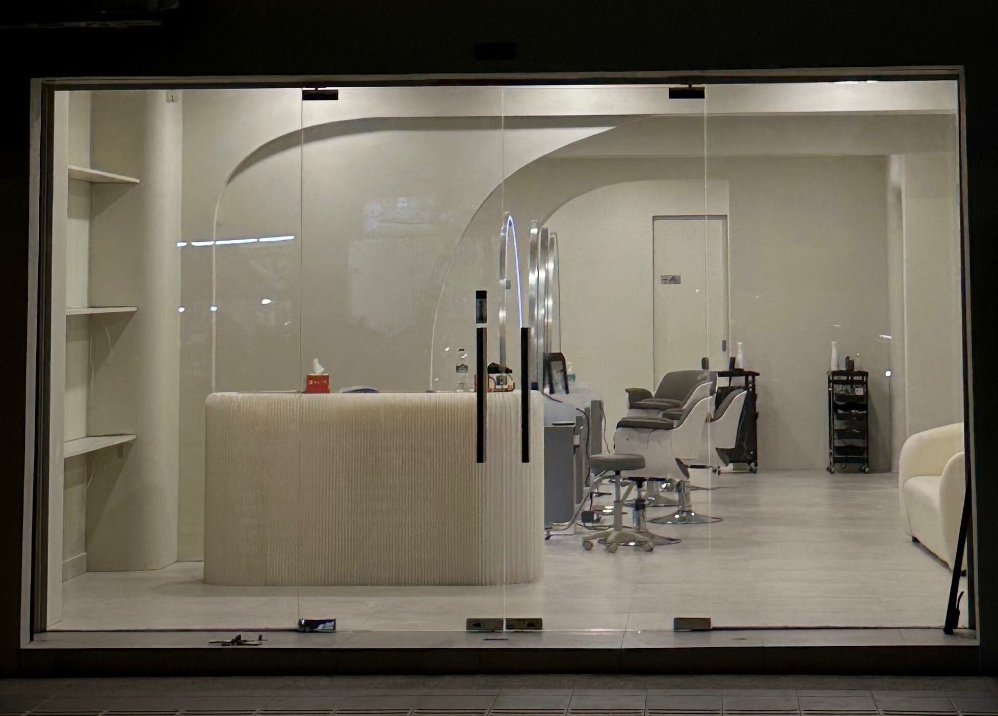 Stylish interior view of LILS SALON in Cyberjaya, Selangor, MY showcasing modern decor and sleek chairs.