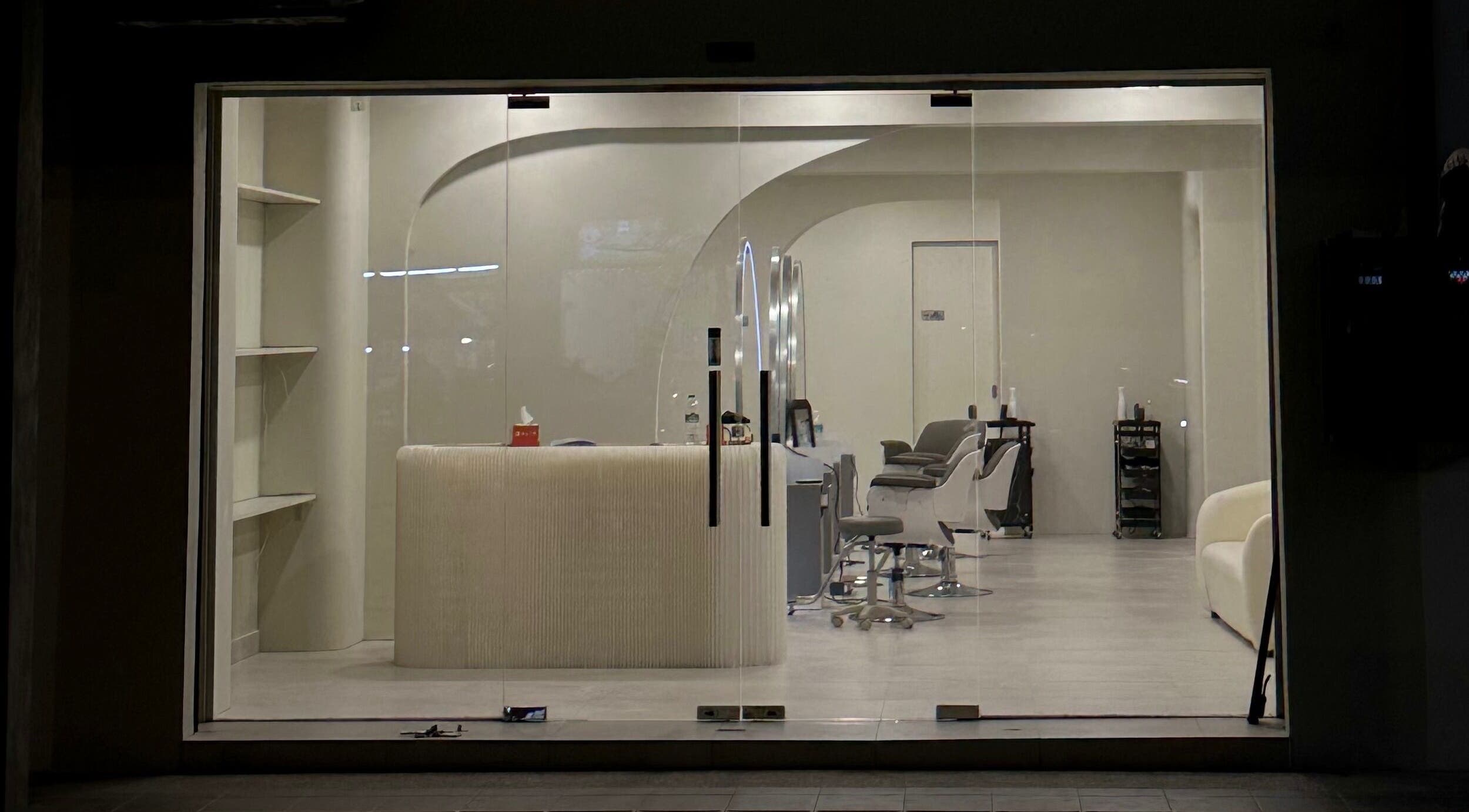 Stylish interior view of LILS SALON in Cyberjaya, Selangor, MY showcasing modern decor and sleek chairs.