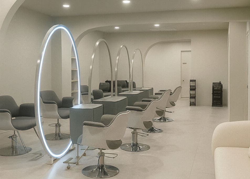 Sleek interior of LILS SALON in Cyberjaya, Selangor, MY featuring modern chairs and illuminated mirrors.