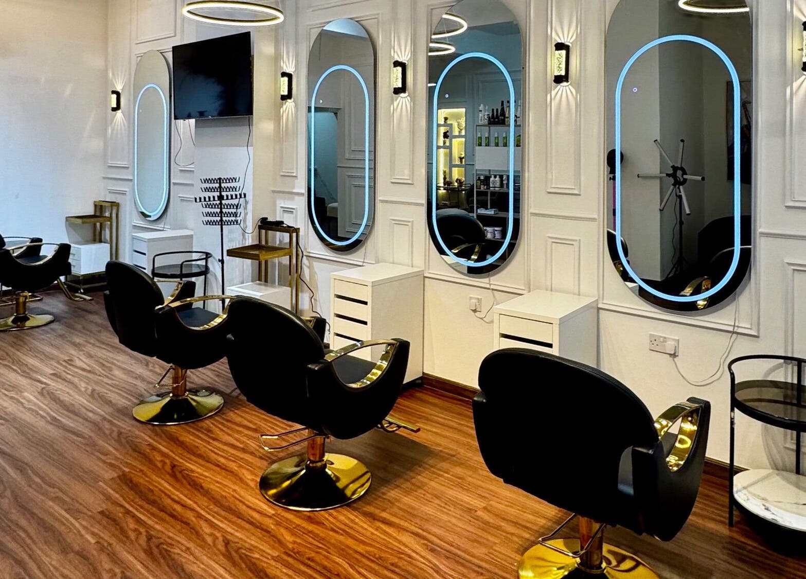 Chic interior at Just A Smile Beauty Salon (Ladies) in Doha, Doha Municipality, QA showcasing stylish salon chairs.