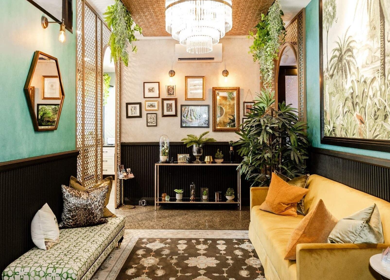Inviting lounge area at Cry Baby Cosmetic Ink, Melbourne, Victoria, AU with chic decor and vibrant plants.