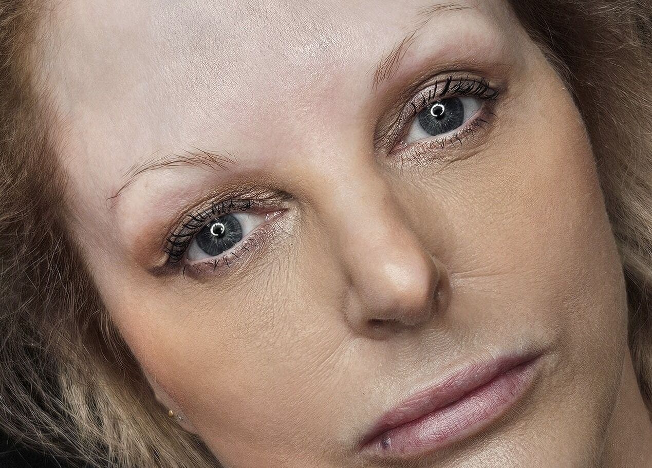 Close-up of a woman's face showcasing cosmetic ink at Cry Baby Cosmetic Ink, Melbourne, Victoria, AU.