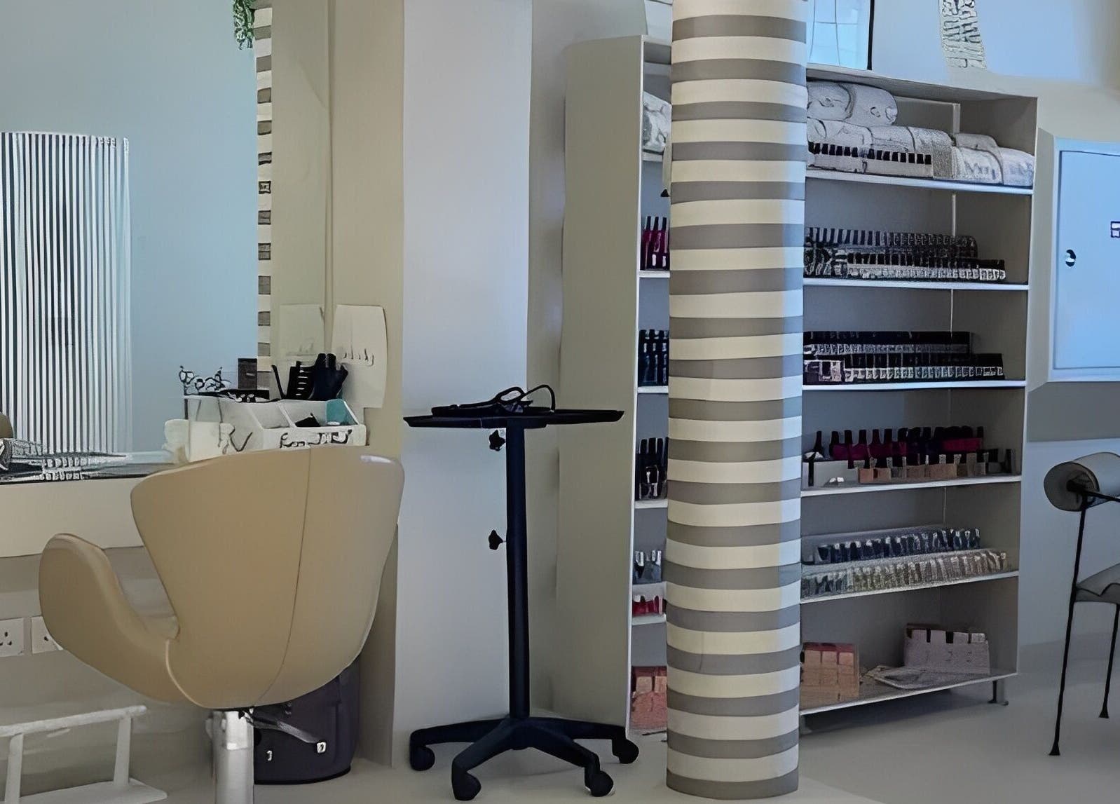 Cozy beauty station at betterfy, Riyadh, SA showcasing salon chair and organized products shelf.