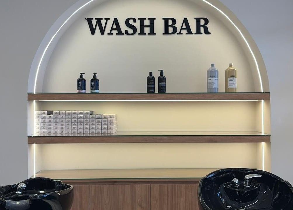 Wash bar at Diamond Beauty, Jeddah, Makkah Province, SA with sleek chairs and products on display.