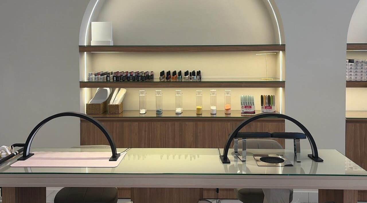 Nail station at Diamond Beauty in Jeddah, Makkah Province, SA featuring elegant tools and nail polish.
