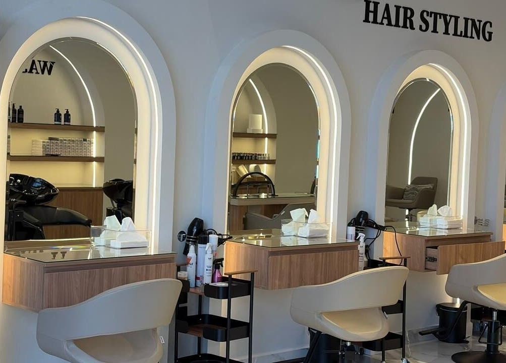 Stylish hair styling stations at Diamond Beauty | الماسة, Jeddah, Makkah Province, SA featuring backlit mirrors.