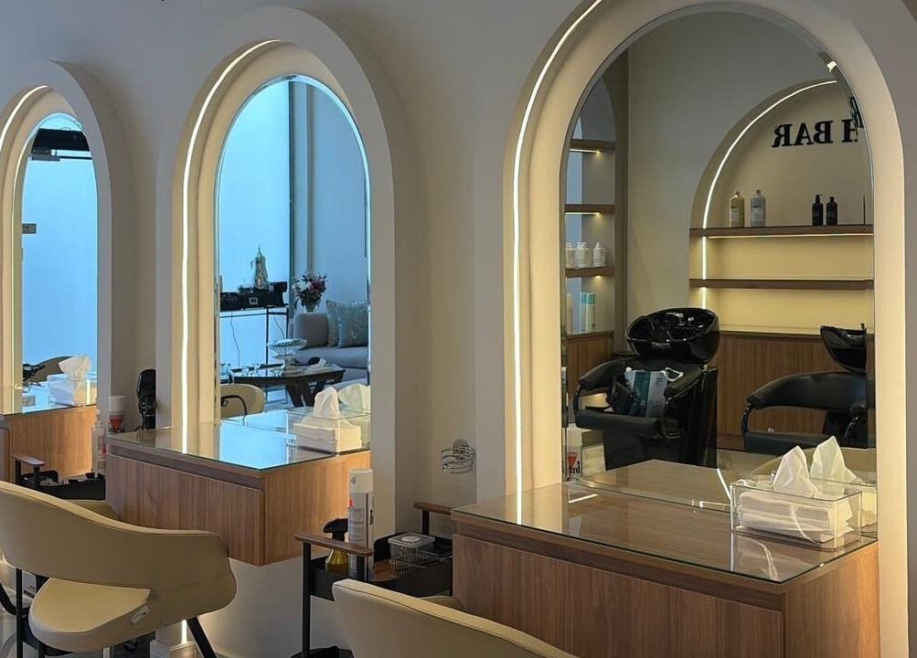Modern salon interior at Diamond Beauty | الماسة, Jeddah, Makkah Province, SA, featuring stylish seating and mirrors.