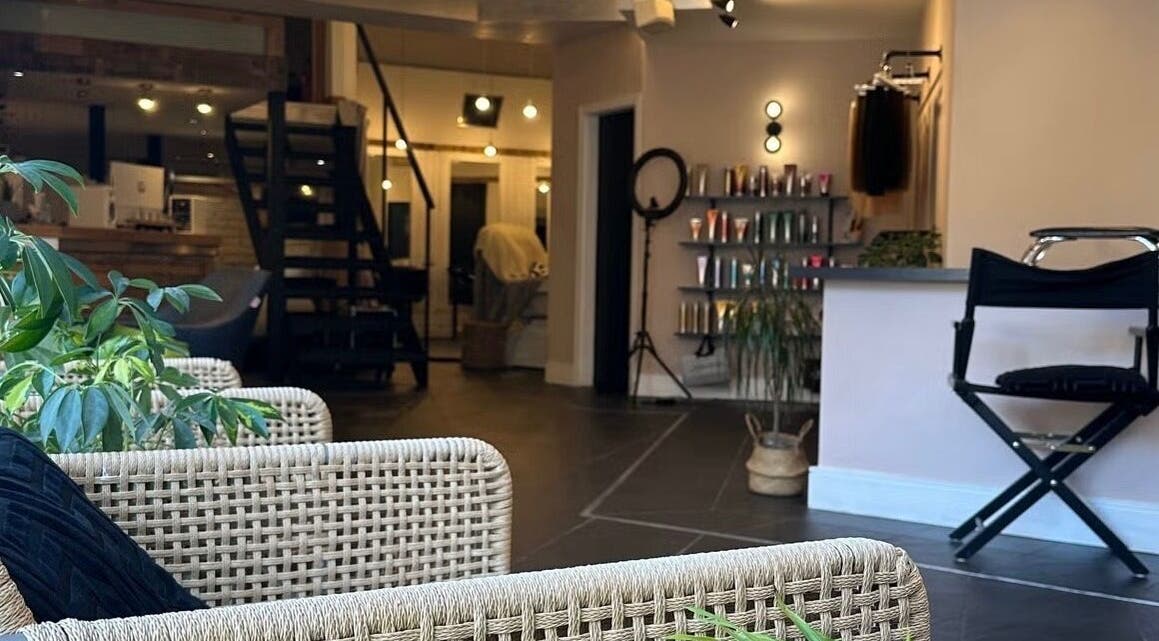 Welcoming interior of The Ink Fairy in Torquay, England, GB, featuring stylish seating and vibrant decor.