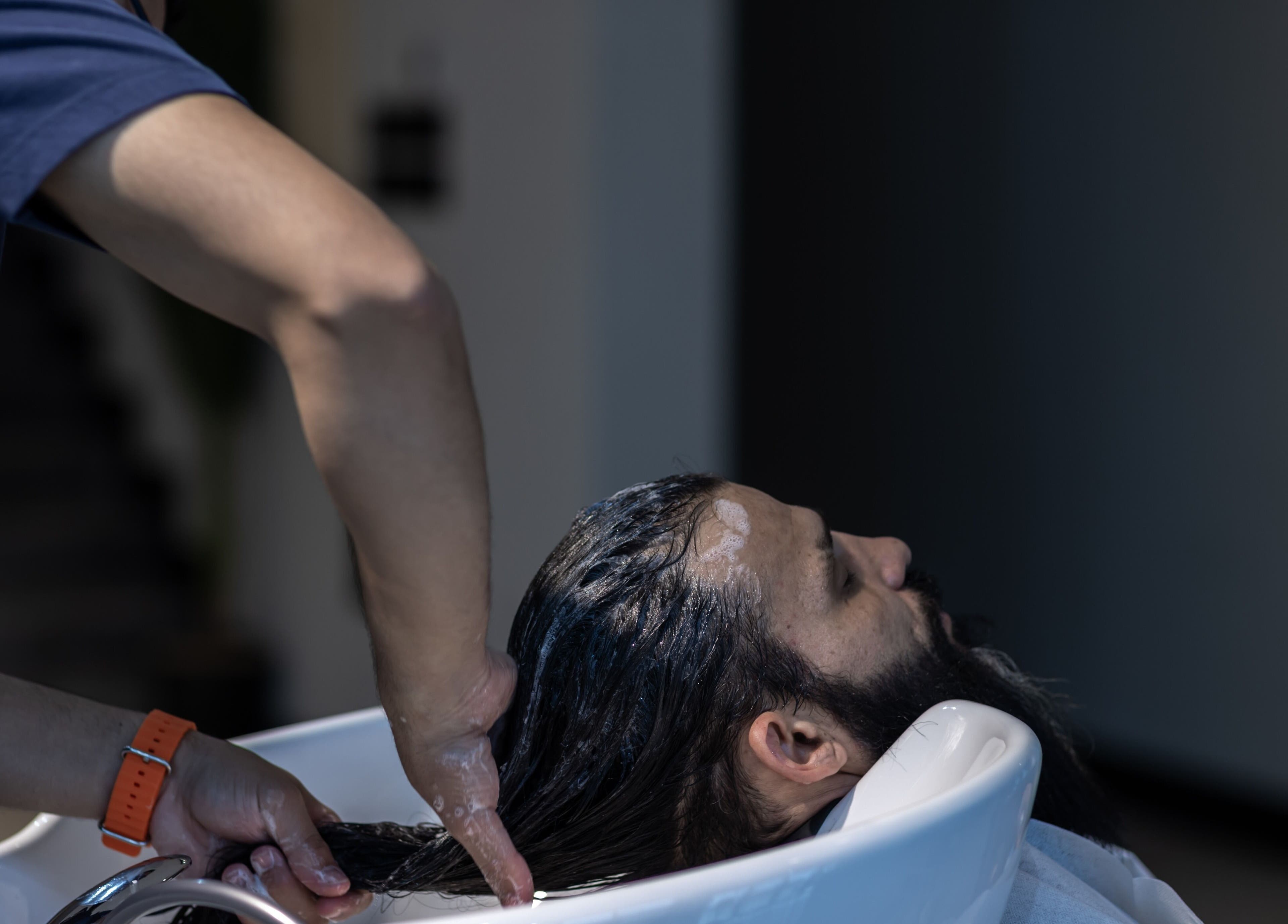 Client receiving a soothing hair wash at Suave Hair Salon & Spa | سواف للاسترخاء والحلاقة, Riyadh, Riyadh Province, SA.