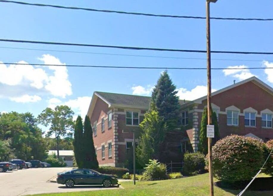 View of Waxed by Rhi building in Lakeville, Massachusetts, US, amid serene greenery.