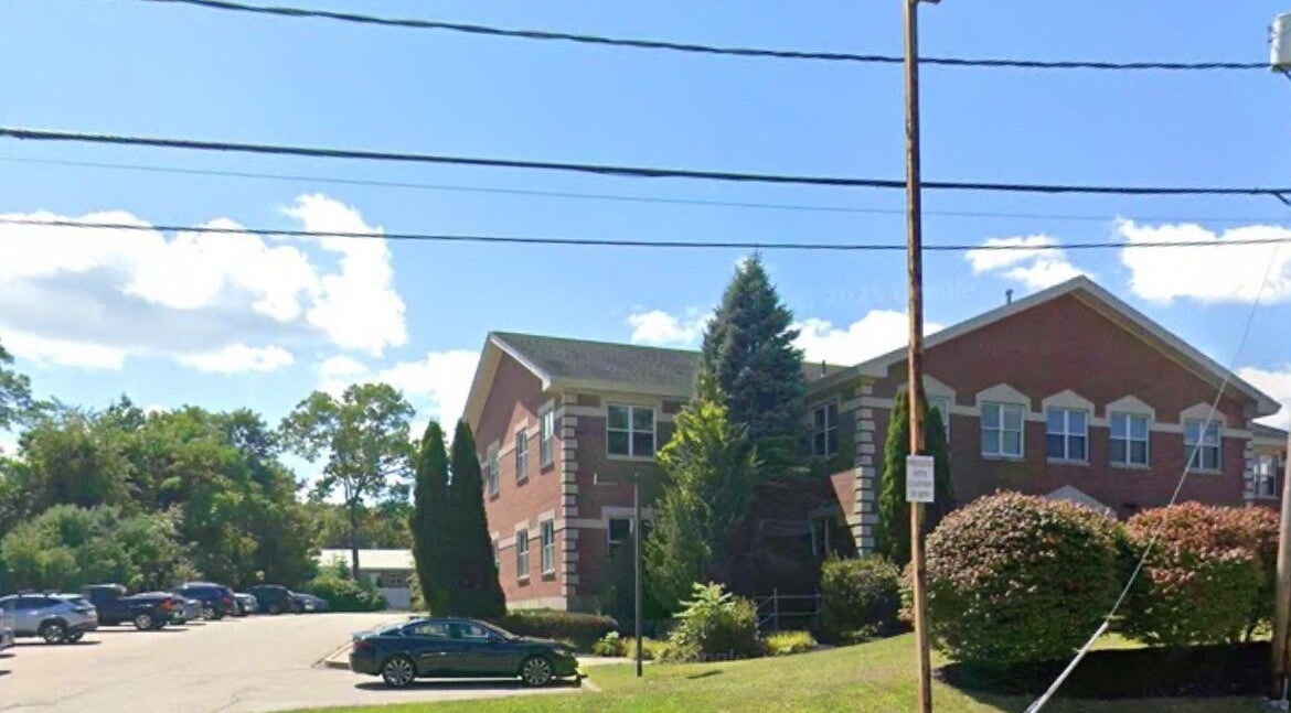 View of Waxed by Rhi building in Lakeville, Massachusetts, US, amid serene greenery.