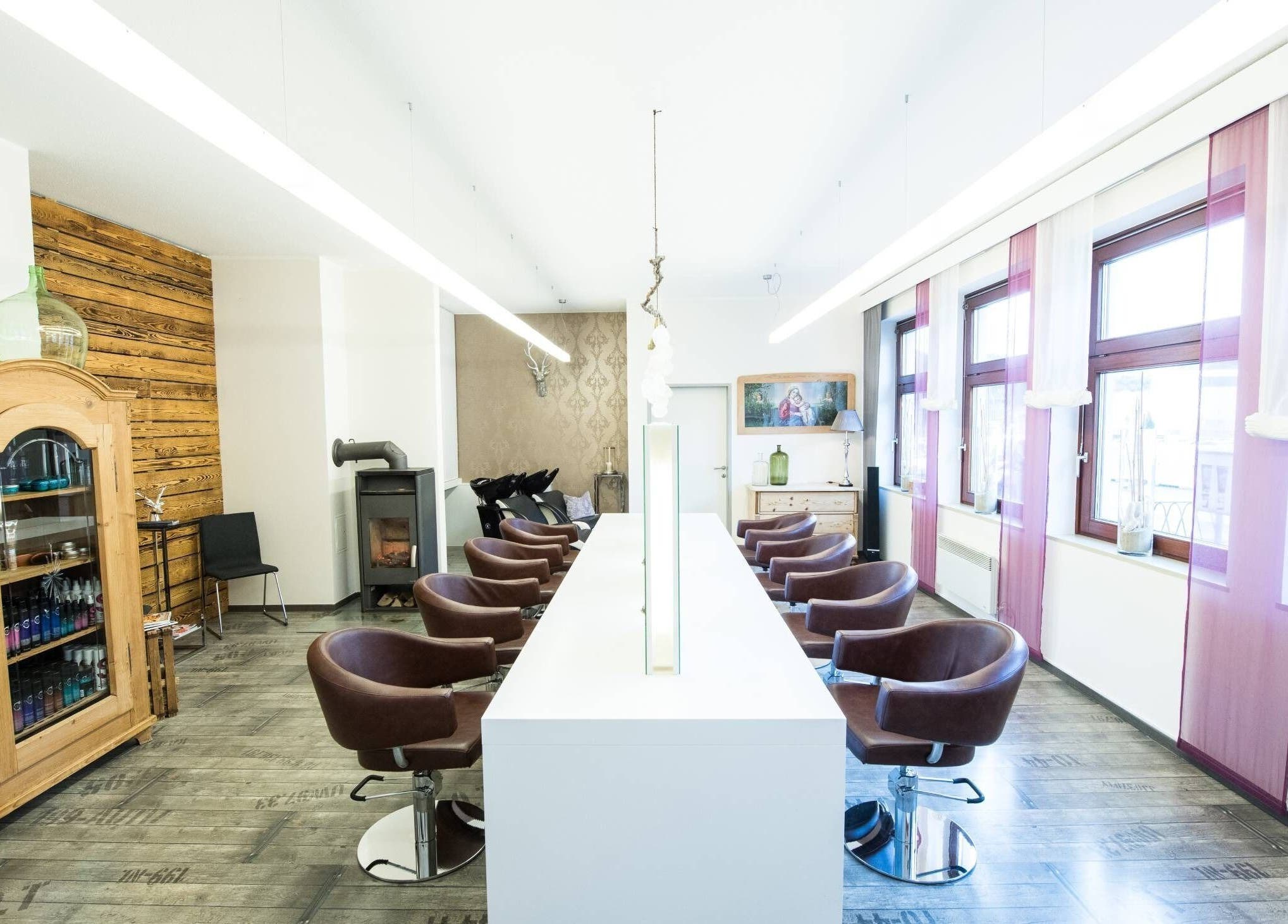 Sleek salon interior at Aurion Labs, Wien, Wien, AT, featuring modern chairs and stylish decor.