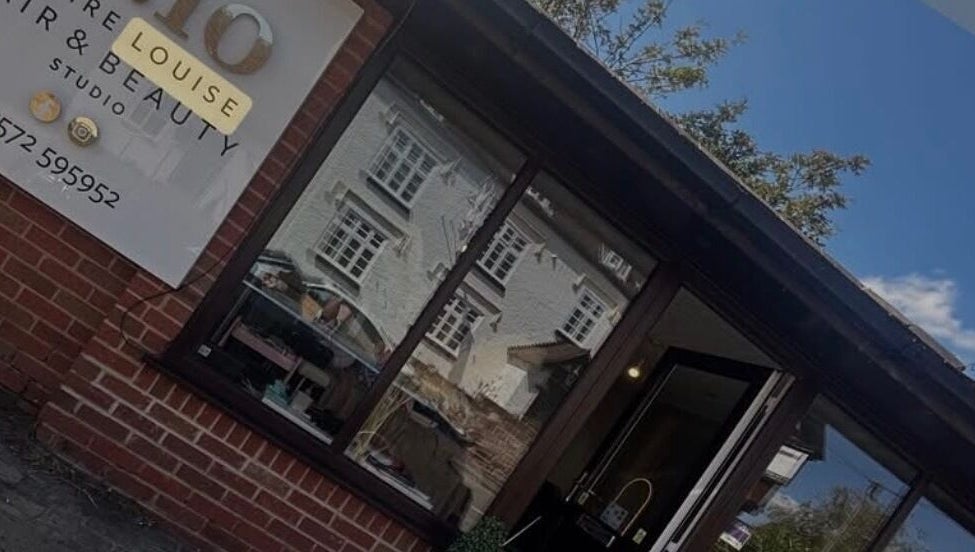 C.lo Hair and Beauty salon exterior in Hartlebury, England, GB with signage and window reflection.