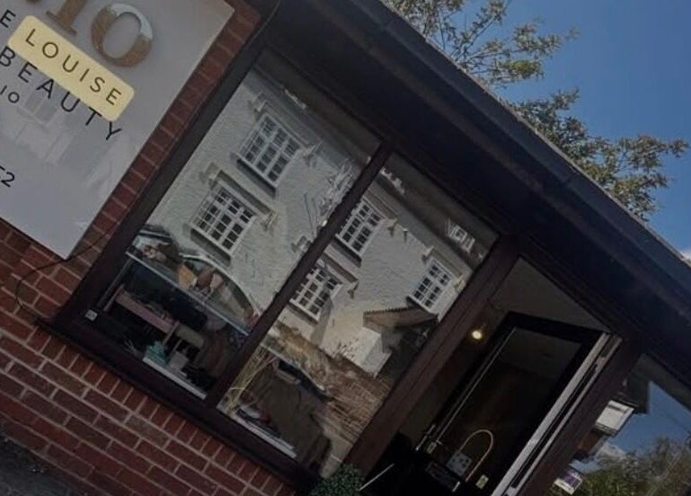 C.lo Hair and Beauty salon exterior in Hartlebury, England, GB with signage and window reflection.