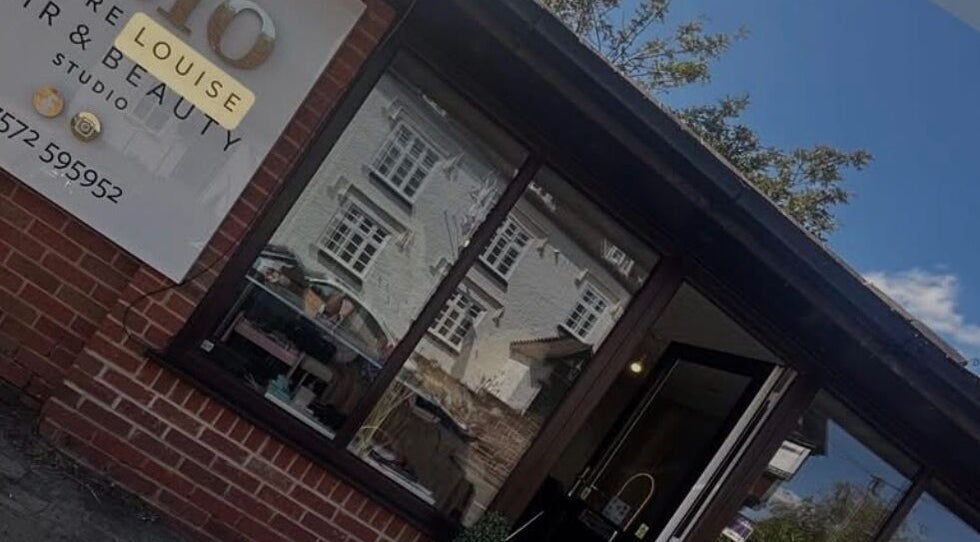 C.lo Hair and Beauty salon exterior in Hartlebury, England, GB with signage and window reflection.