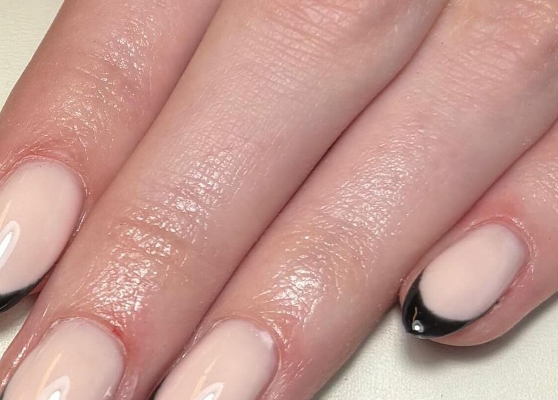 Elegant French manicure at Hollie’s Nails, Radcliffe, England, GB, showcasing precise black tips.