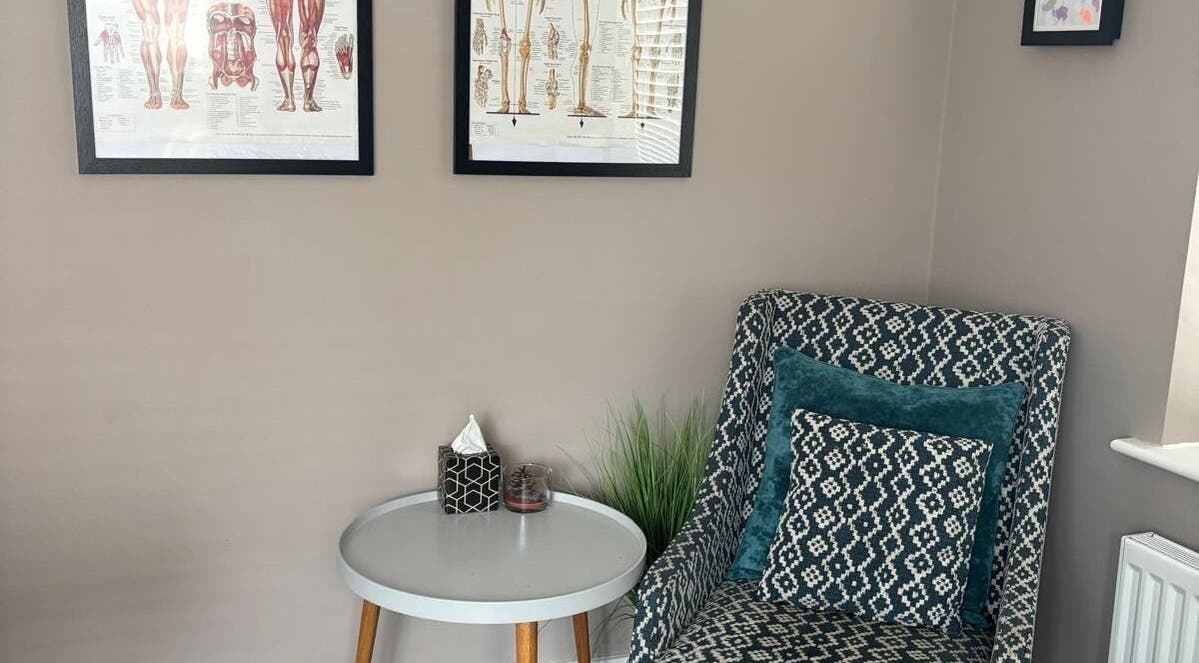 Inviting sitting area at THRIVE Massage Therapy - QUORN, Quorn, England, GB with stylish chair and artwork.