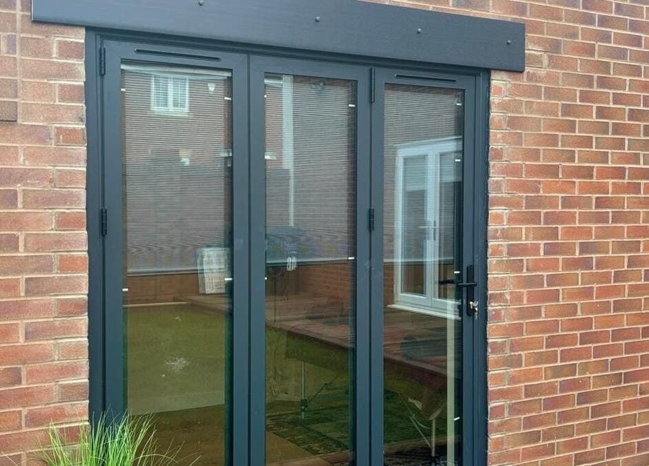 Entrance of THRIVE Massage Therapy - QUORN in Quorn, England, showcasing a sleek glass door.
