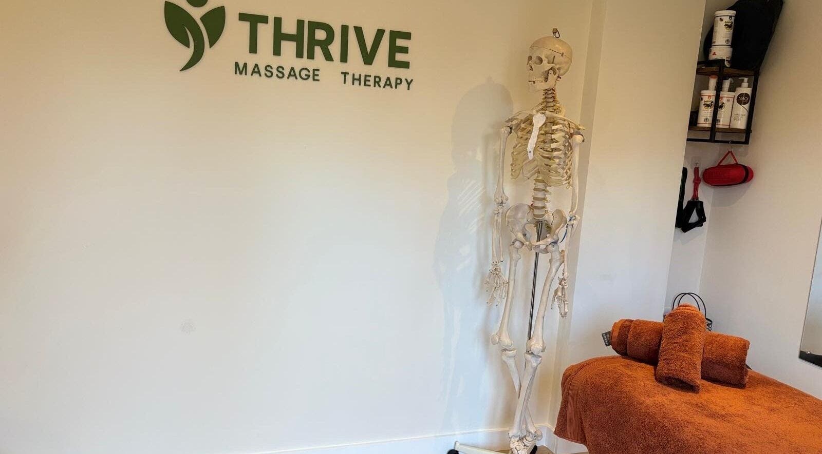 Interior of THRIVE Massage Therapy - QUORN with cozy treatment table, Quorn, England, GB.