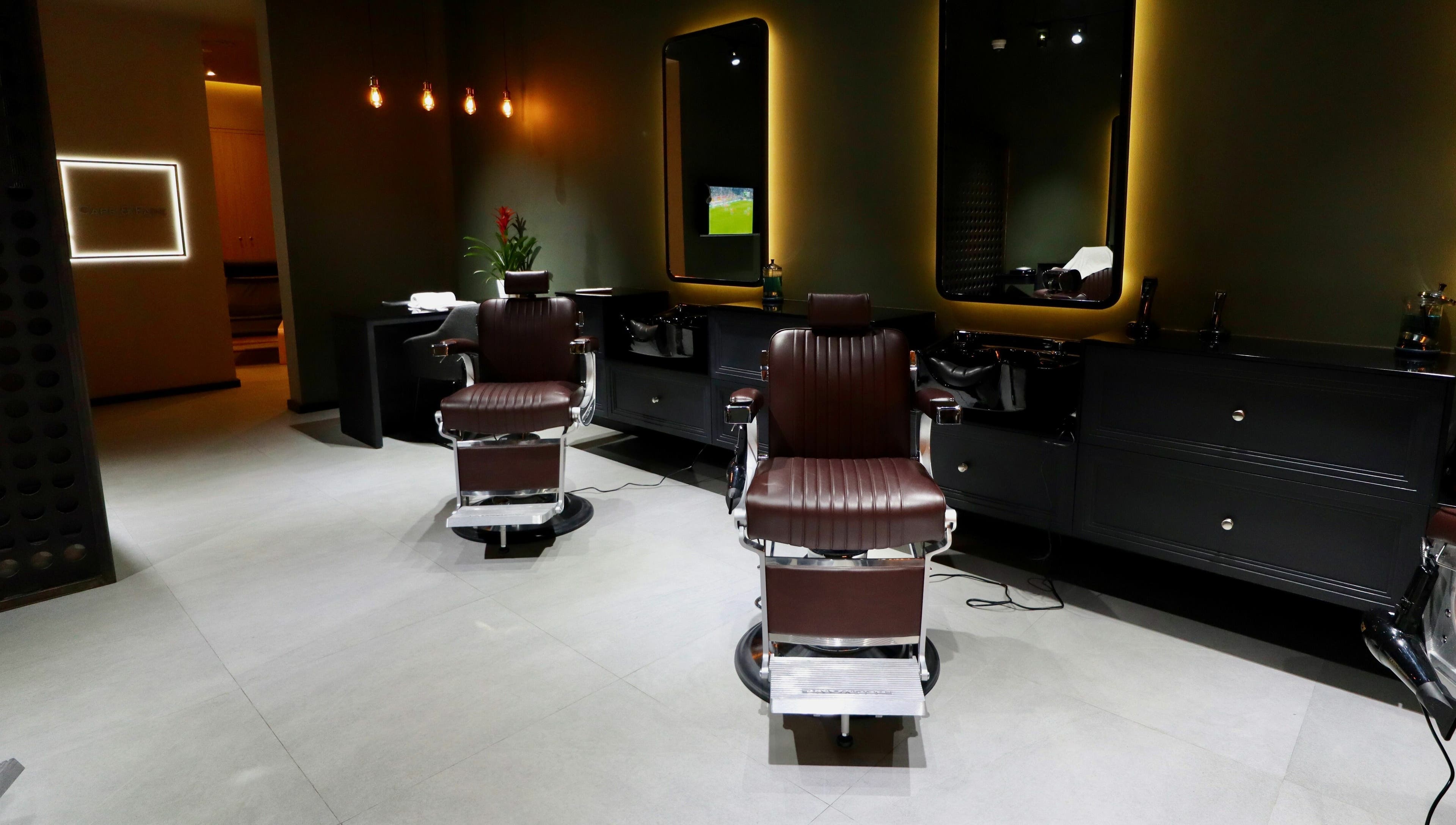 Sleek barber chairs at Cape & Fade in Dubai, AE, showcasing a modern and luxurious salon interior.