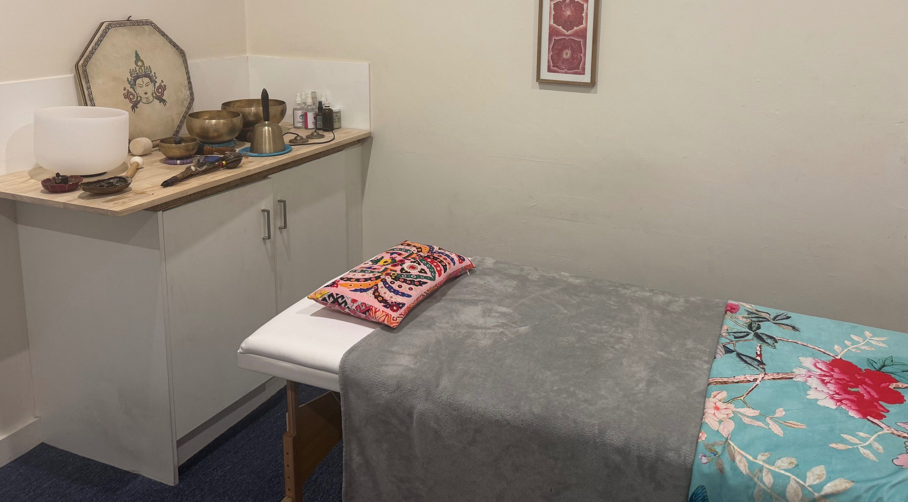 Healing room with vibrant decor at Crystal Healing Sanctuary, Glenelg, South Australia, AU. Tranquil setup.