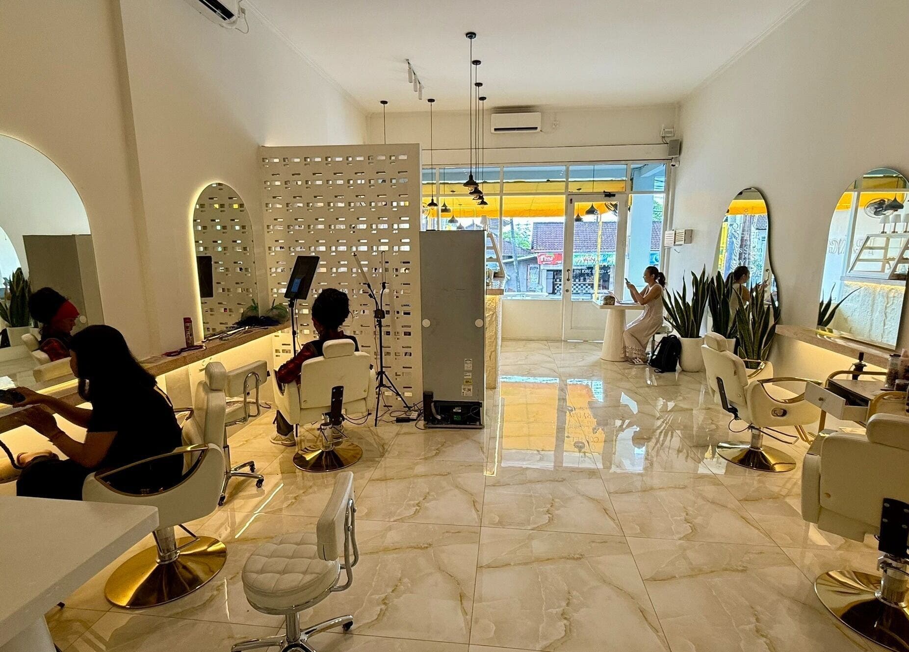 Interior view of Frangi Braids Salon in Bali, Bali, ID showcasing modern decor and comfortable seating.