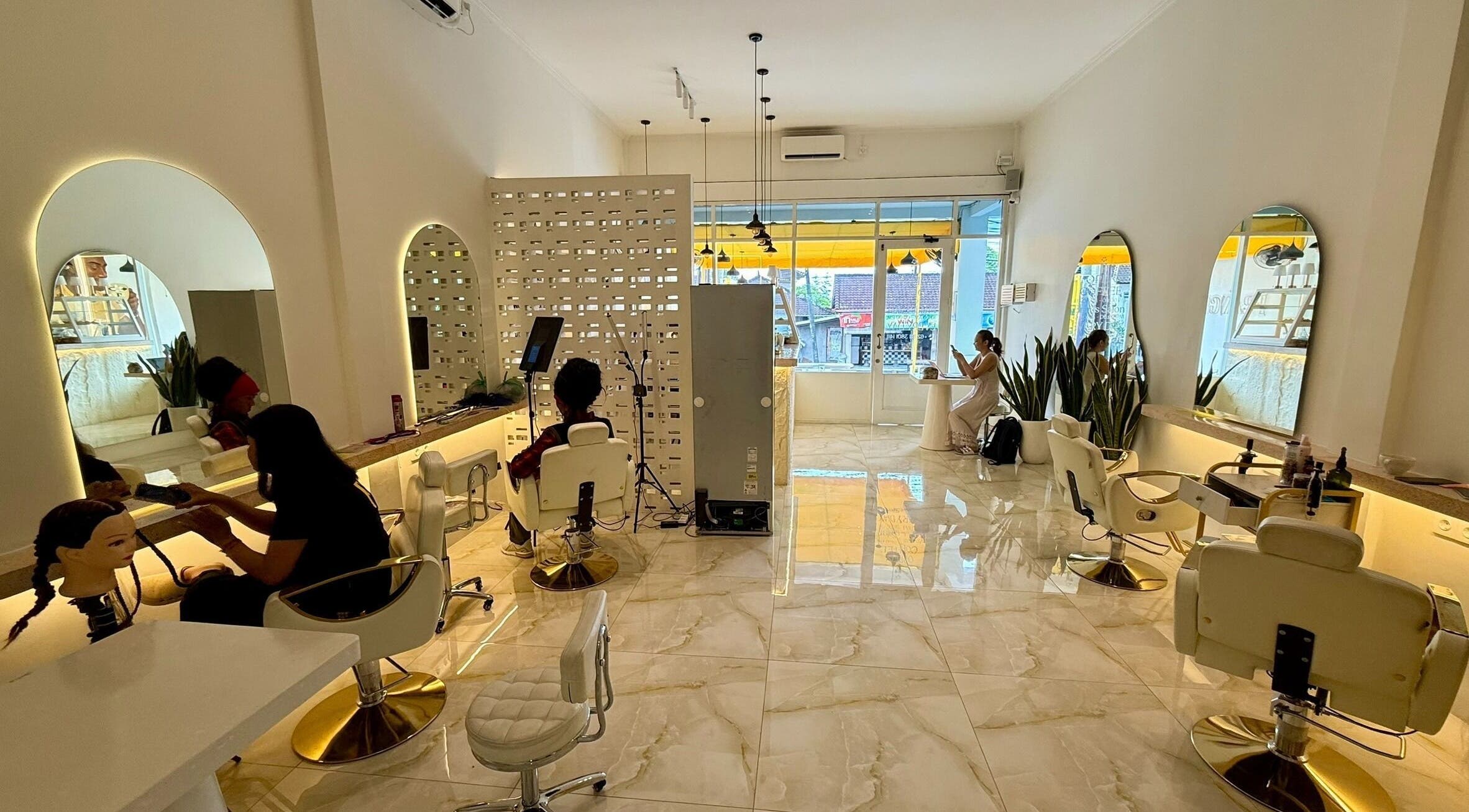 Interior view of Frangi Braids Salon in Bali, Bali, ID showcasing modern decor and comfortable seating.