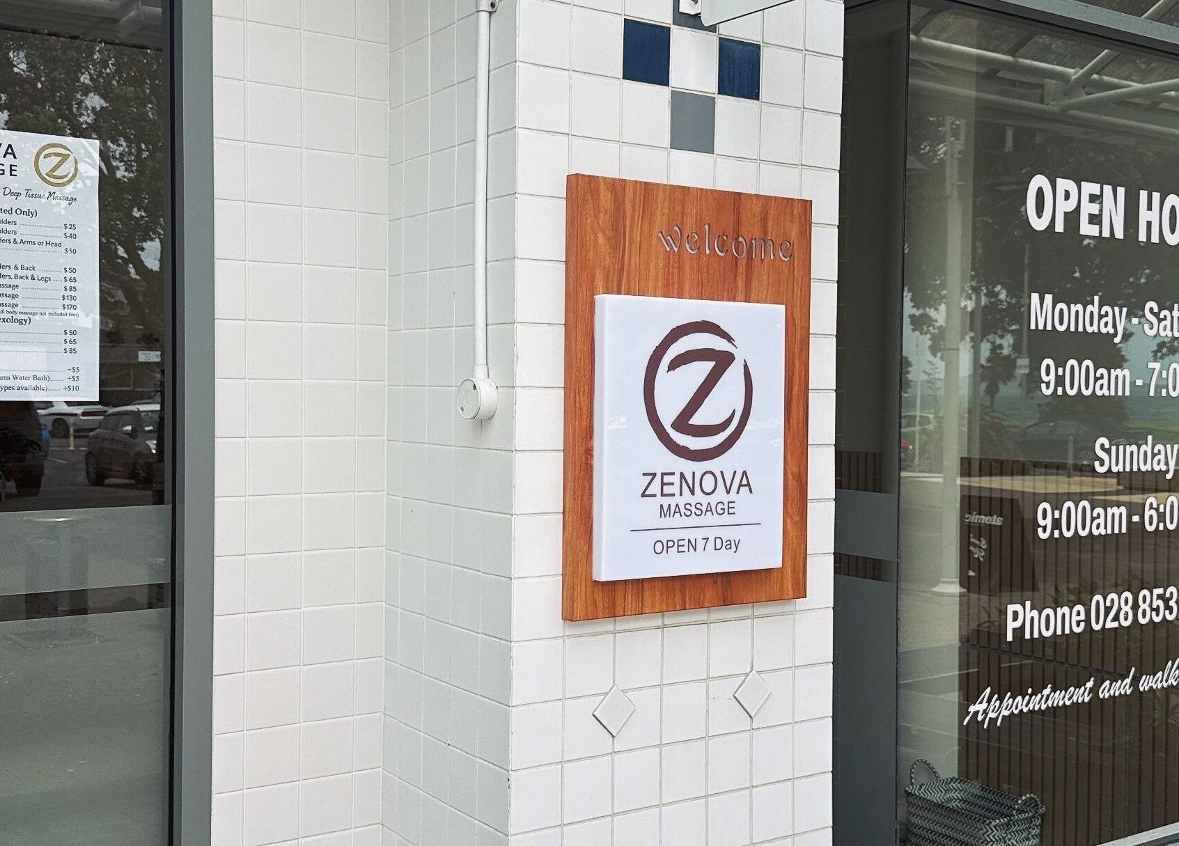 Entrance of Zenova Massage in Auckland, Auckland, NZ, showcasing hours and accessibility signage.