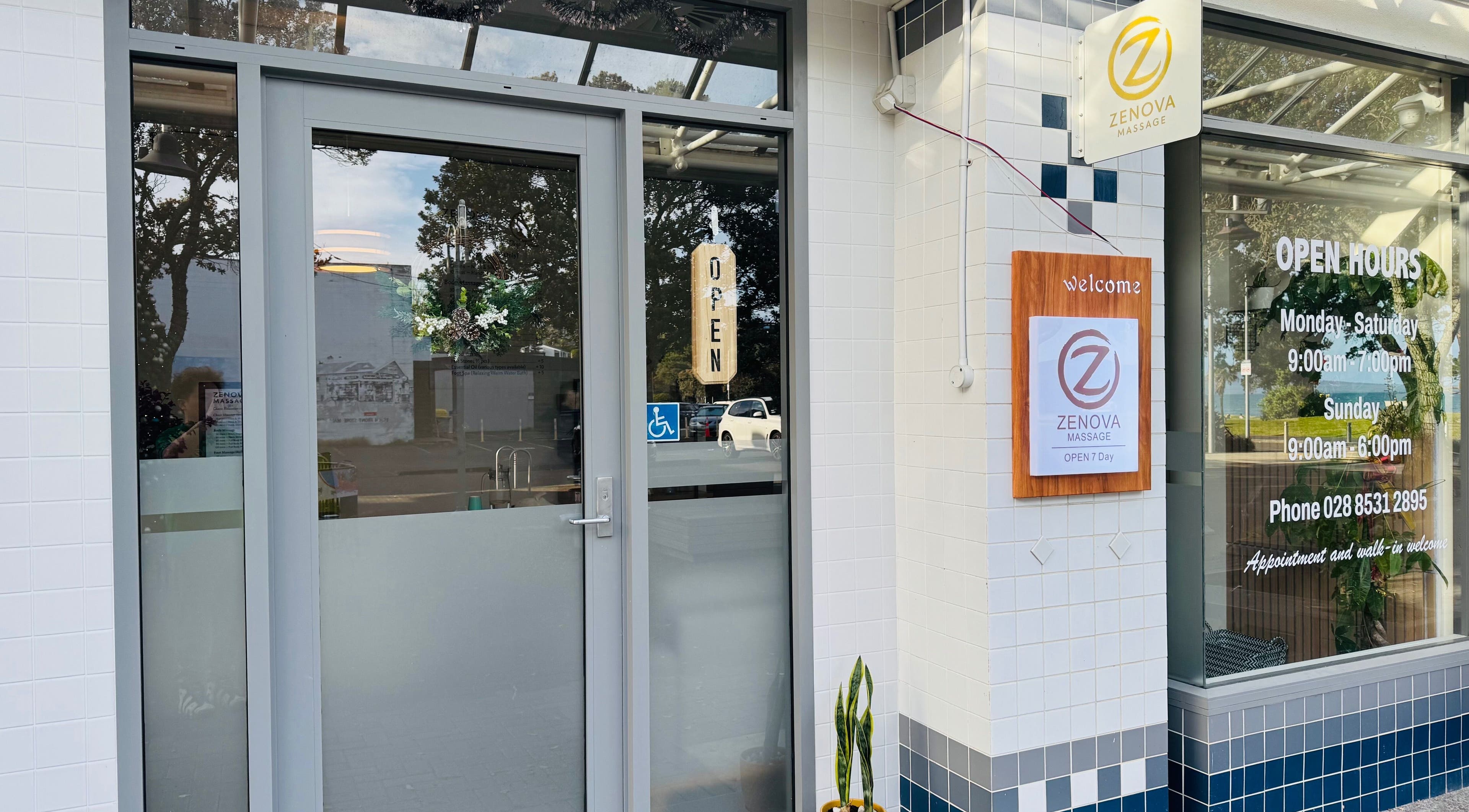 Front entrance of Zenova Massage in Auckland, NZ, showcasing signage and open hours.