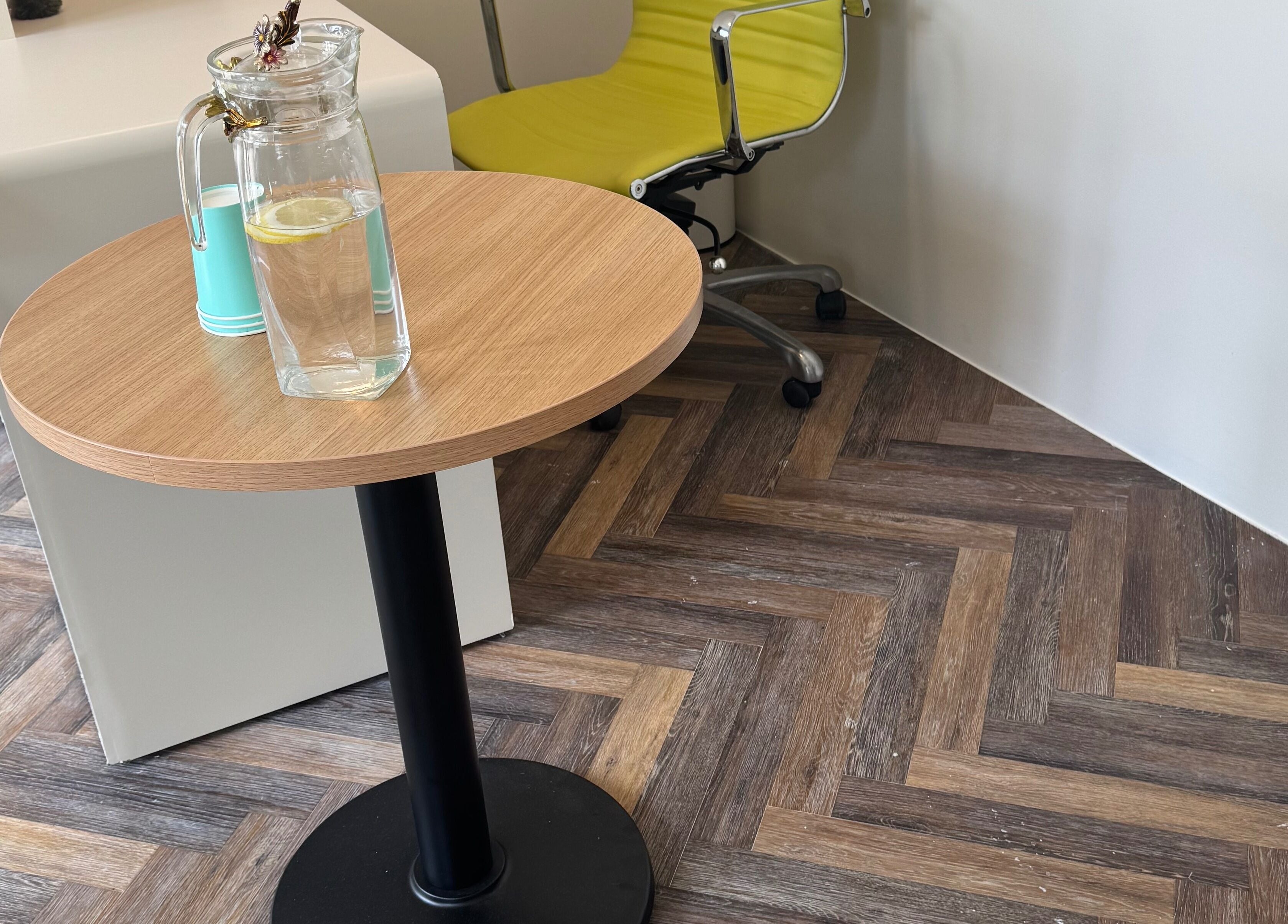 Zenova Massage reception in Auckland, NZ with a table and lemon water for guests.