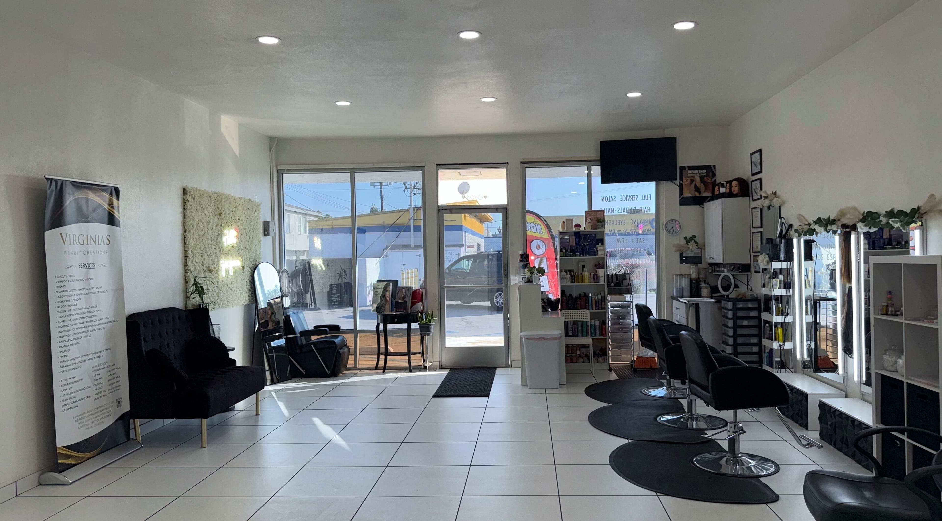 Modern chic interior of Belleza Glam Studio, South Gate, California, US featuring sleek styling stations.
