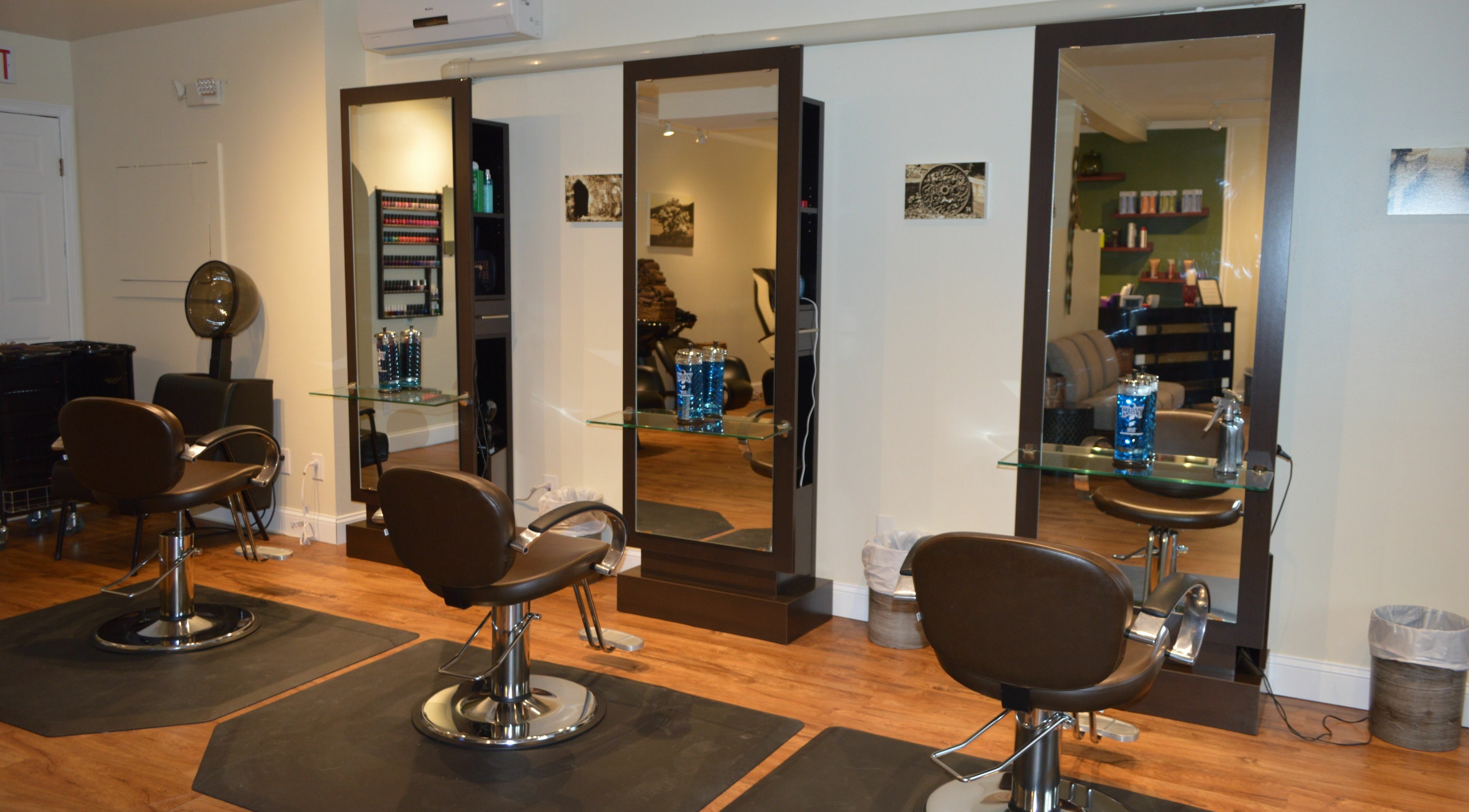 Elegant styling chairs and mirrors at Sizo Salon in Patterson, New York, US, showcasing modern beauty ambiance.