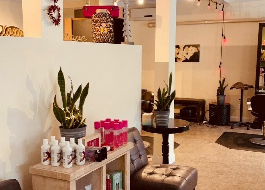 Sizo Salon's modern interior with chic decor in Patterson, New York, US, featuring styled plants and beauty products.