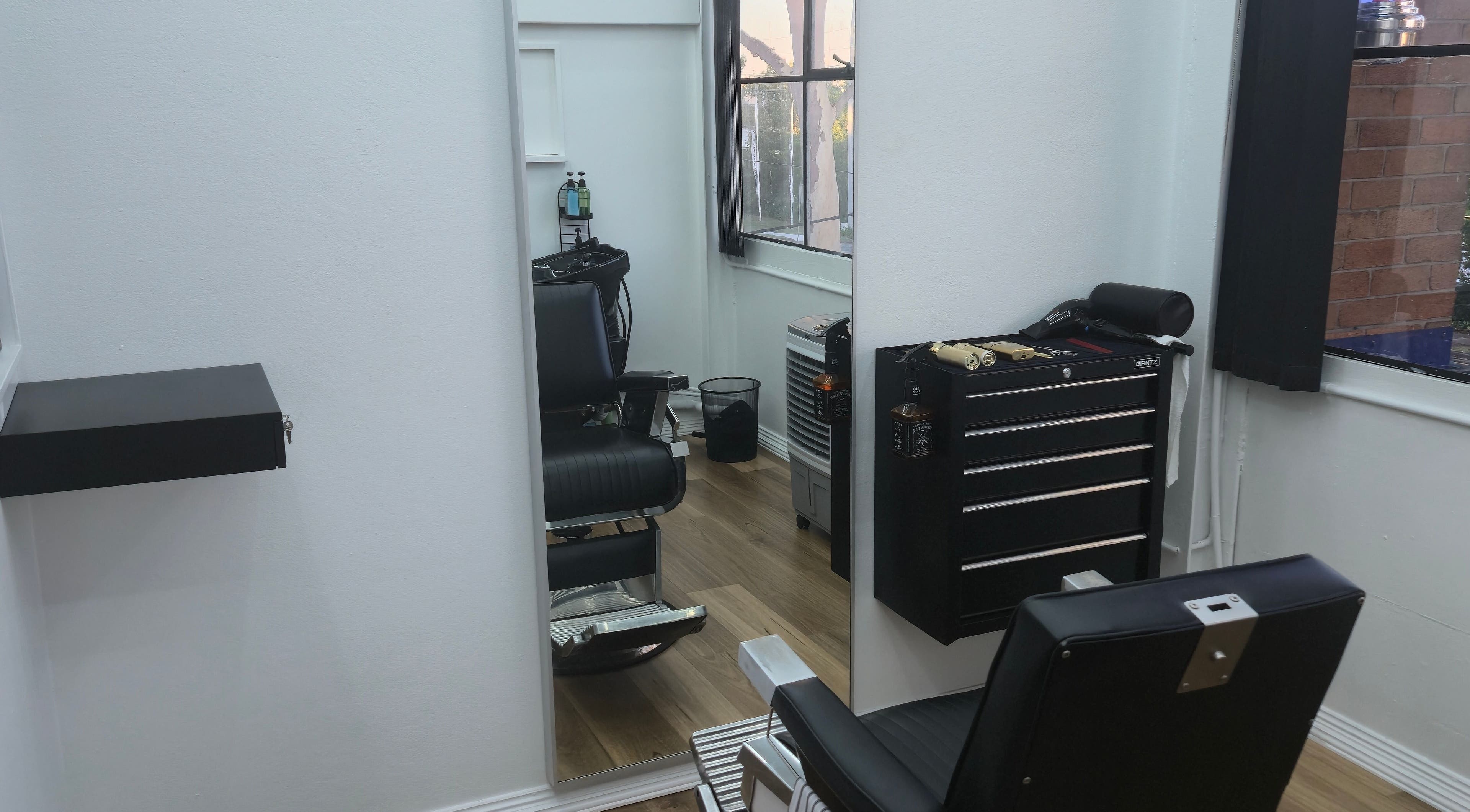 Modern barber chair and tools at Midnight Barber Sydney, Bankstown, New South Wales, AU. Sleek interior design.
