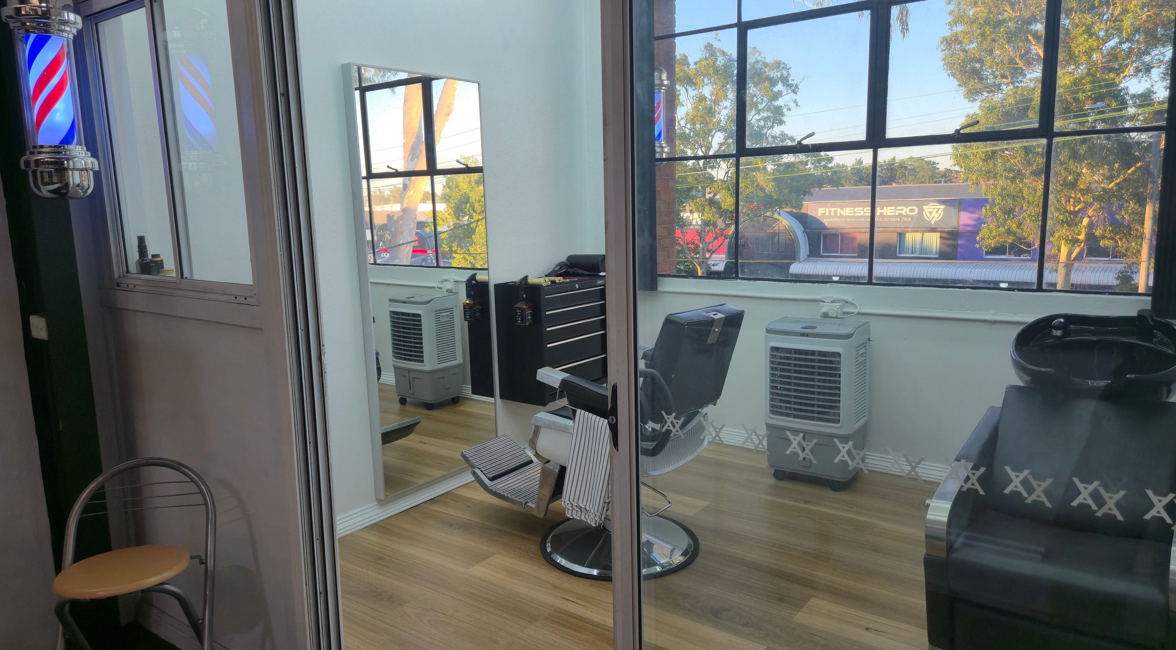 Cozy barber chair in bright room at Midnight Barber Sydney, Bankstown, New South Wales, AU with large windows.
