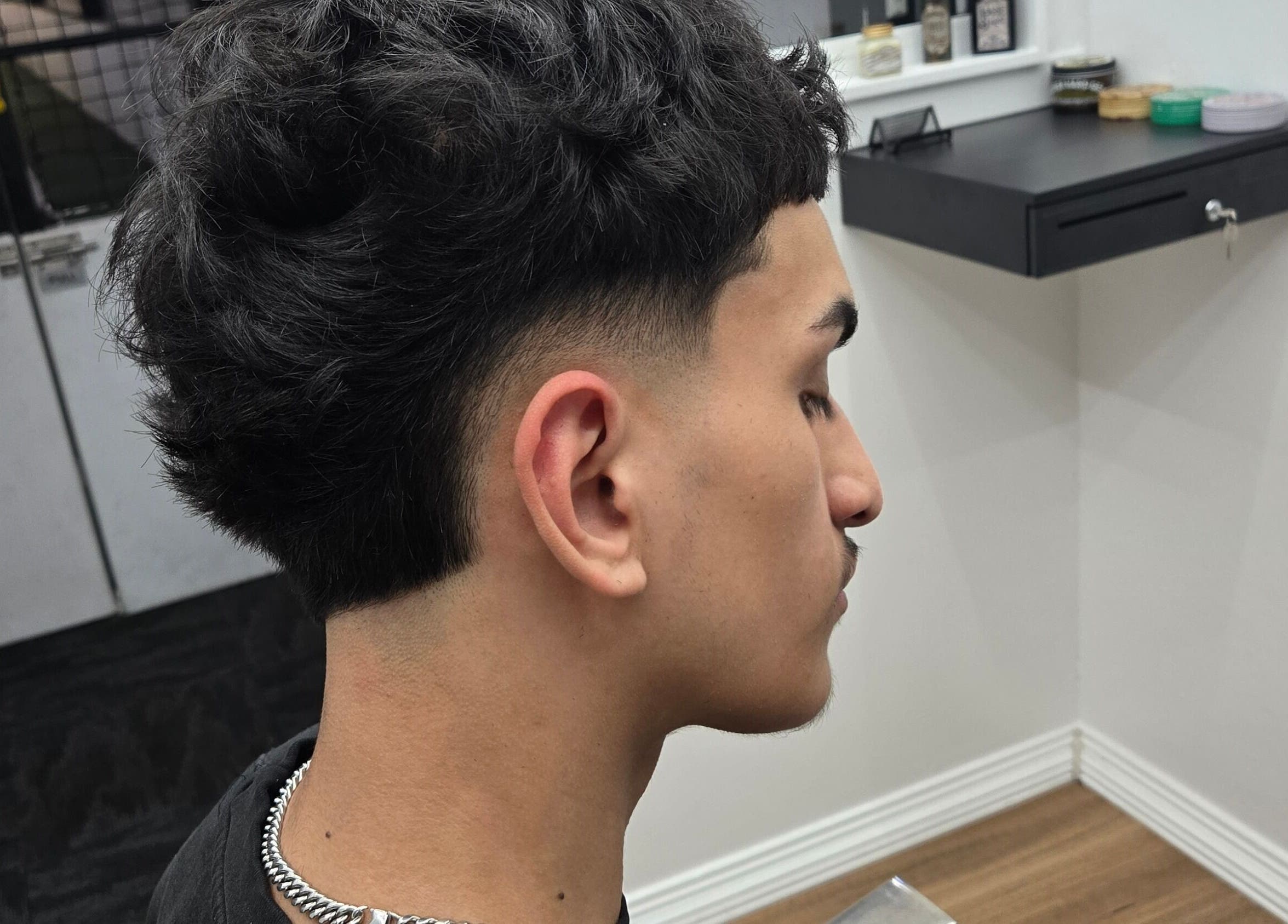 Sleek modern haircut at Midnight Barber Sydney, Bankstown, New South Wales, AU showcasing professional styling.