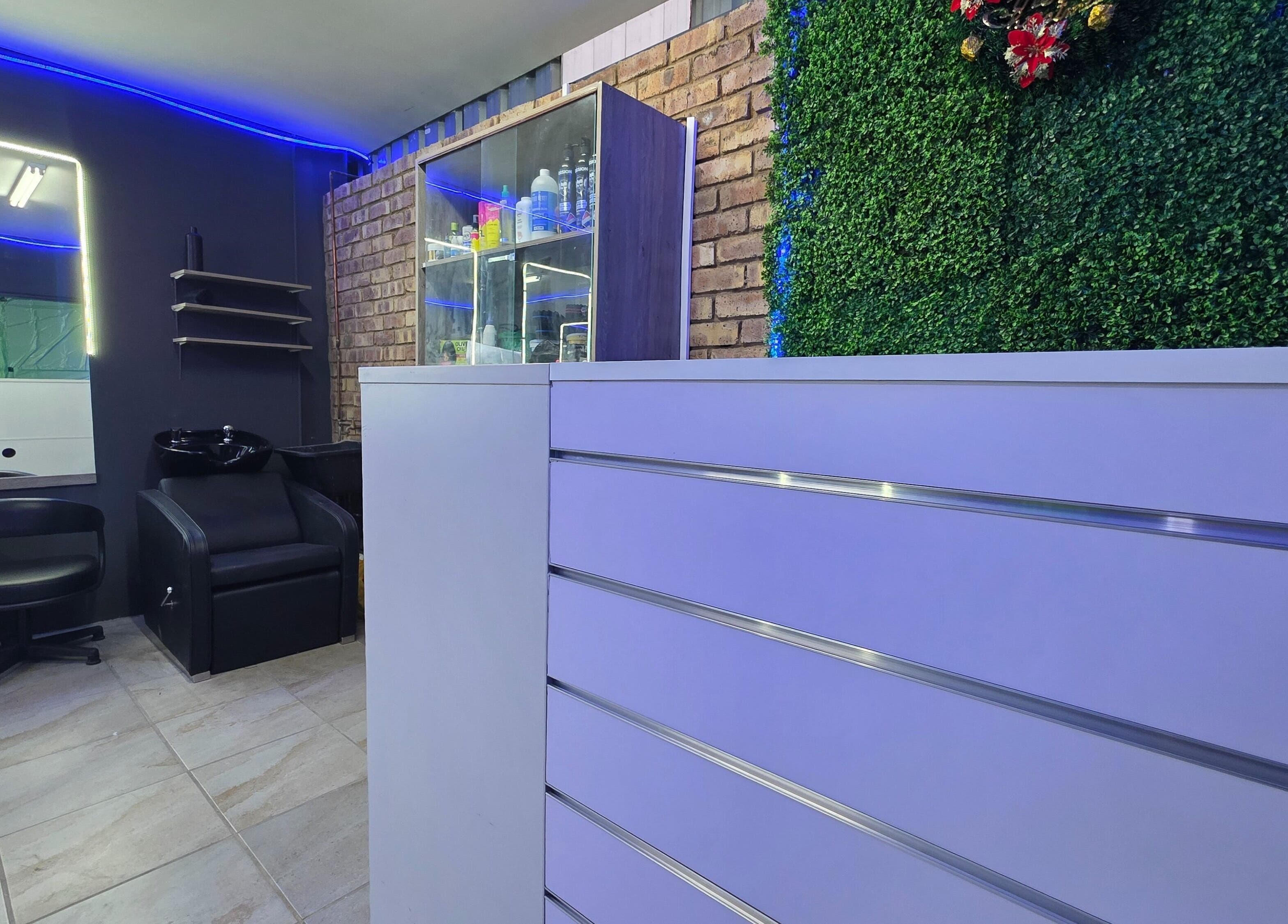 Interior of Dr Barber Hair Salon SA in Johannesburg, Gauteng, ZA with modern decor and sleek styling station.