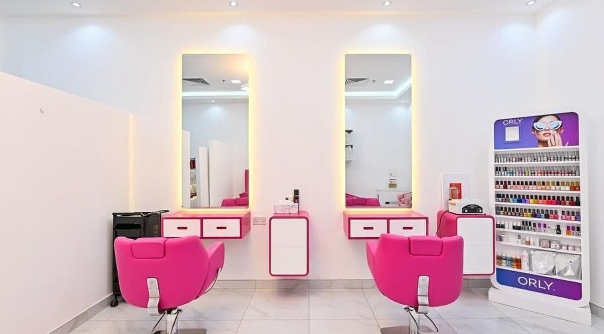 Vibrant pink salon chairs at Princess House Beauty Salon in Dubai, Dubai, AE with modern decor.