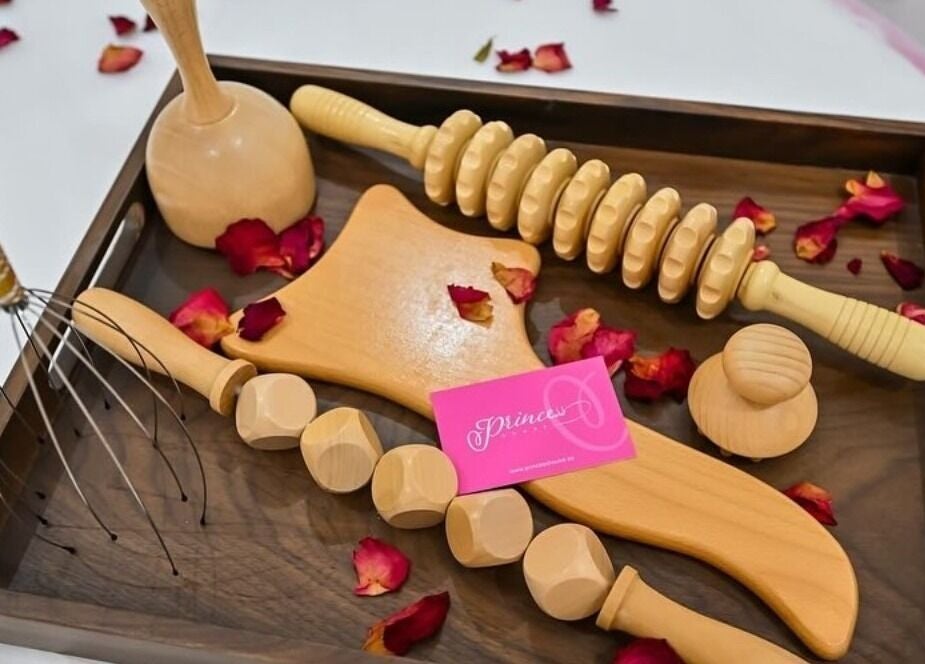 Wooden massage tools with petals at Princess House Beauty Salon, Dubai, Dubai, AE.