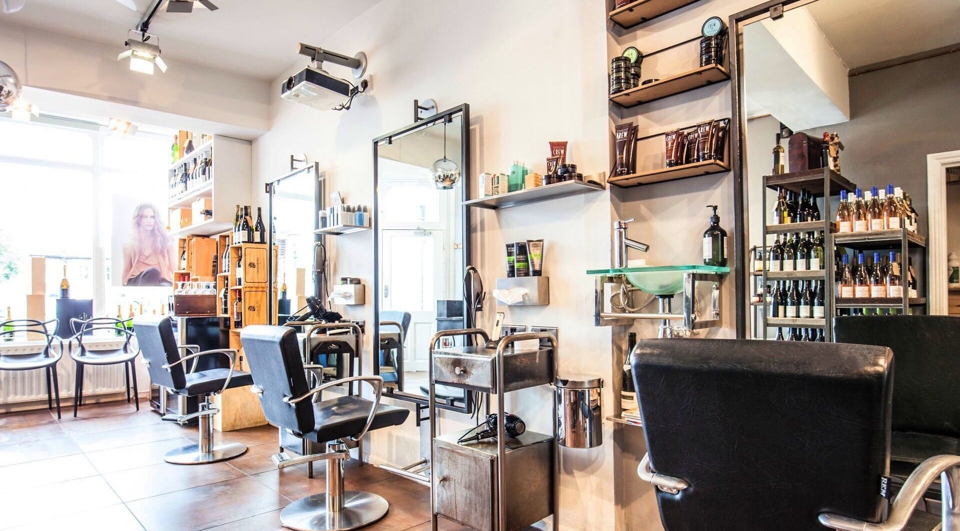 Lelia Hairstylist salon in London, England, GB featuring modern chairs and styling stations.